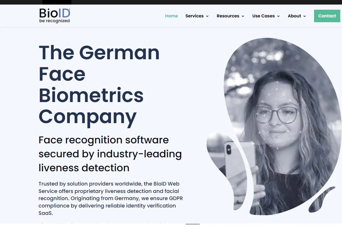BioID homepage featuring 'The German Face Biometrics Company' headline and a woman using a phone for facial recognition.
